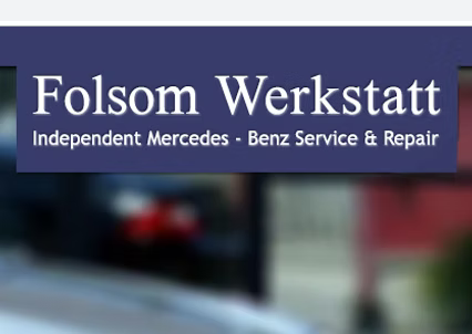 Folsom Werkstatt logo: white text on a dark blue background, with blurred background of cars and buildings.