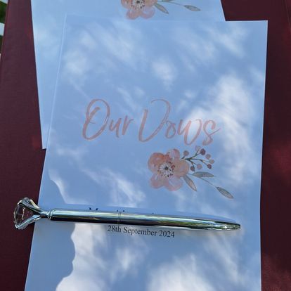 A Pen is Sitting on a Piece of Paper That Says Our Vows — ‘Weddings on the Run’ – Elope with the Travelling Celebrant In Emu Park, QLD