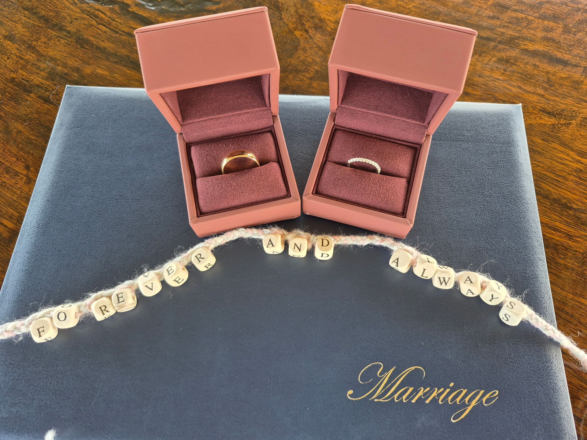 Two Wedding Rings Are Sitting on Top of a Marriage Register — ‘Weddings on the Run’ – Elope with the Travelling Celebrant In Emu Park, QLD