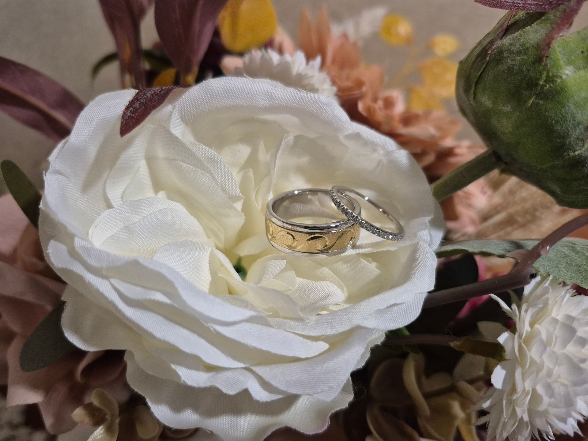 A Table With a Vase of Plants and a Menu on It — ‘Weddings on the Run’ – Elope with the Travelling Celebrant In Emu Park, QLD