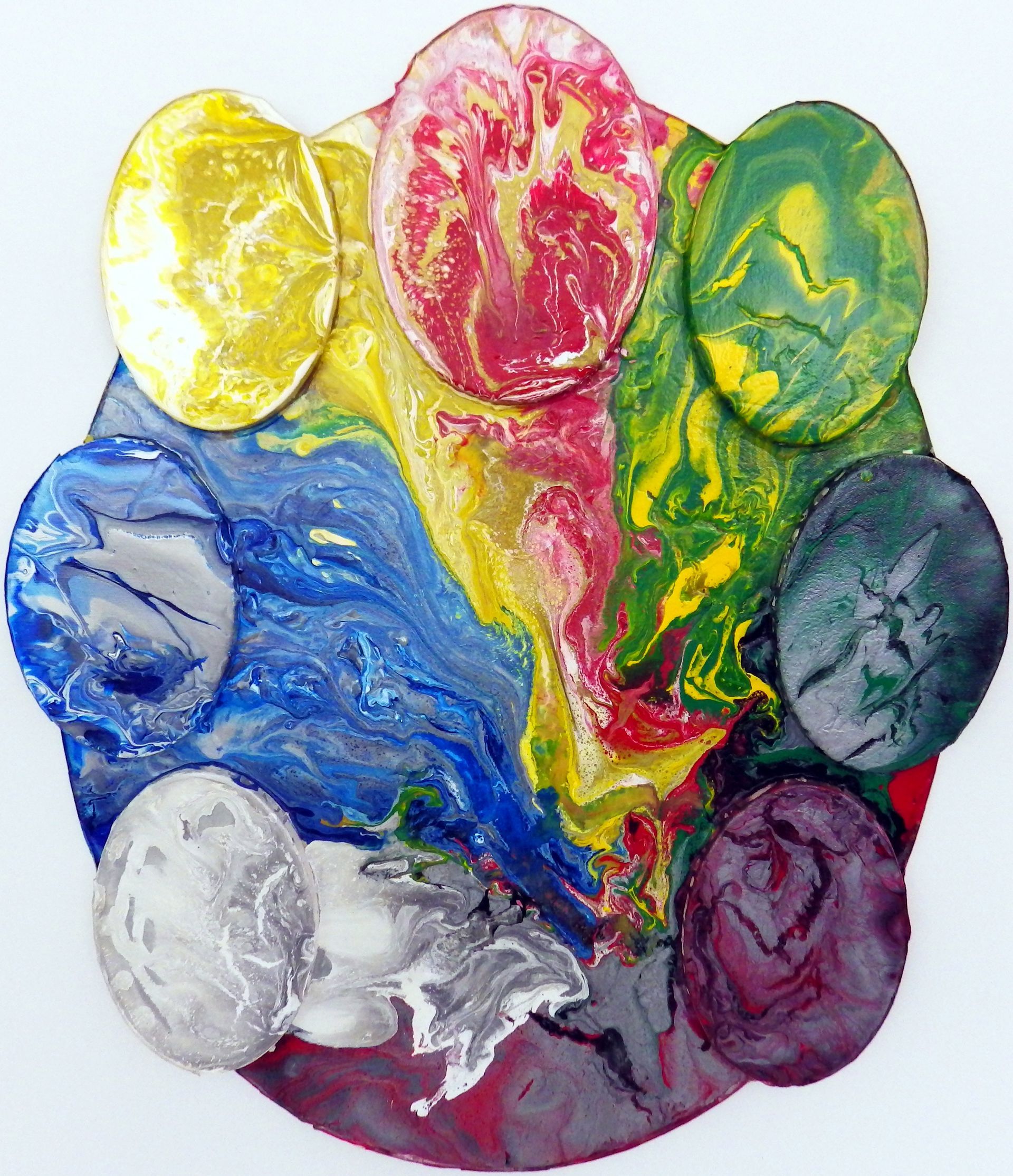 A circle of crayons of different colors on a white surface