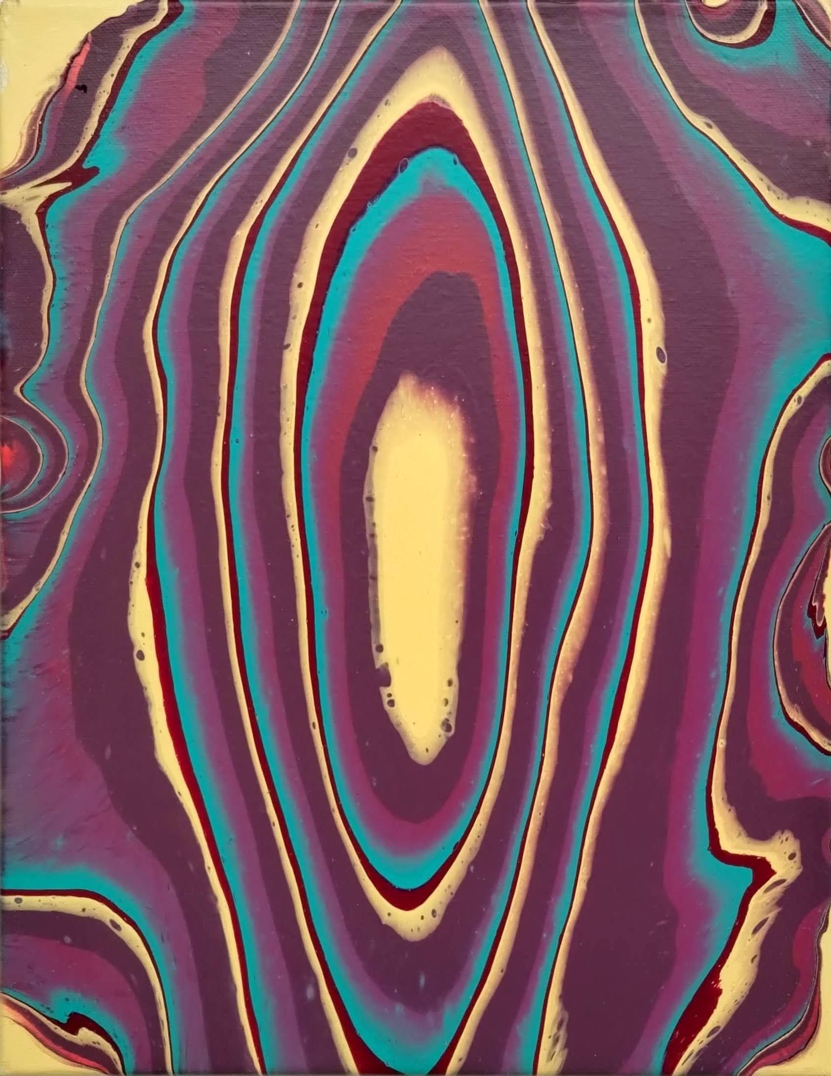 A close up of a colorful painting with a yellow center