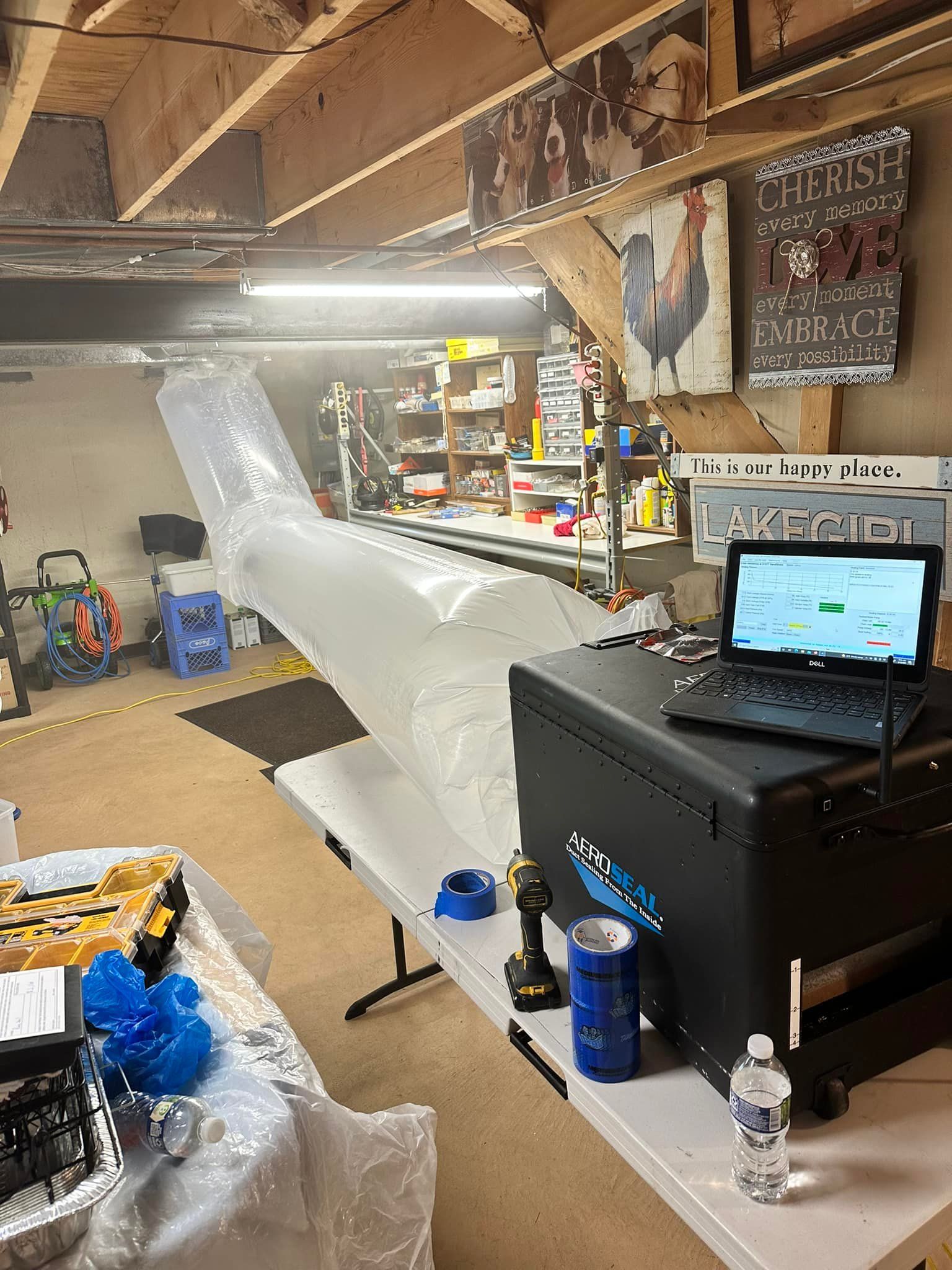 A laptop computer is sitting on top of a table in a room.