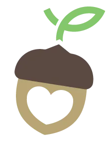 An acorn with a heart cut out of it and a green leaf coming out of it.