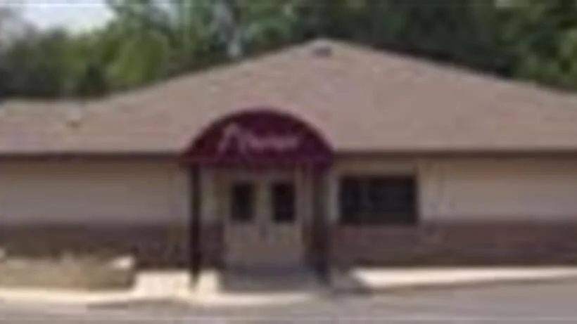 A building with a purple awning on the front of it