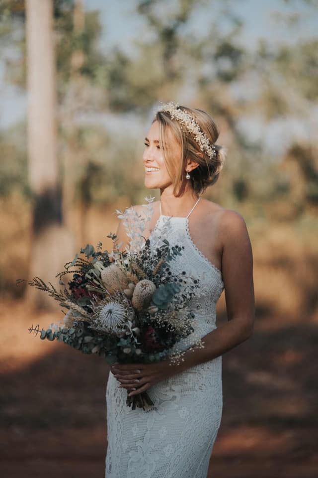 Back of a Person With Brown Hair in an Updo Against a Plain White Background — @miilan in Darwin City, NT