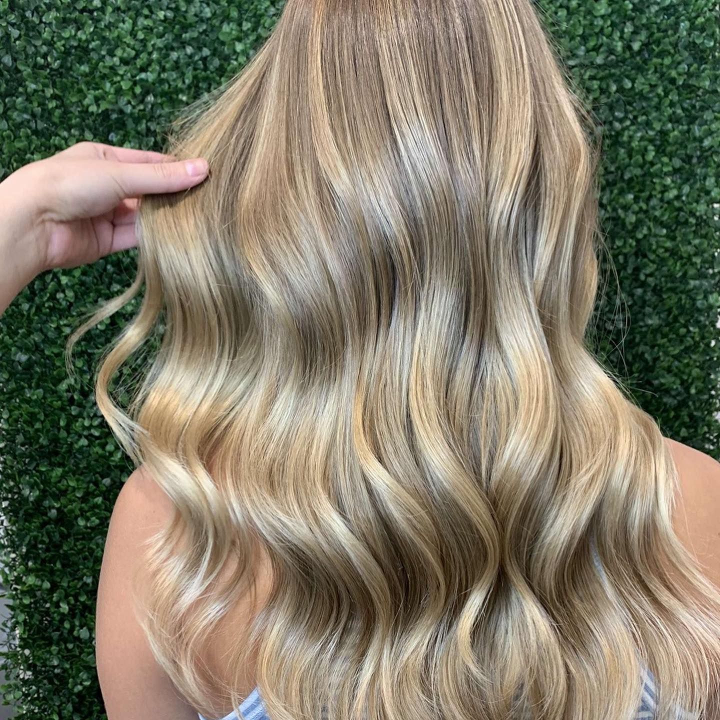 Stylist Braiding Brown Hair With a Comb Clipped in, in a Salon Setting — @miilan in Darwin City, NT