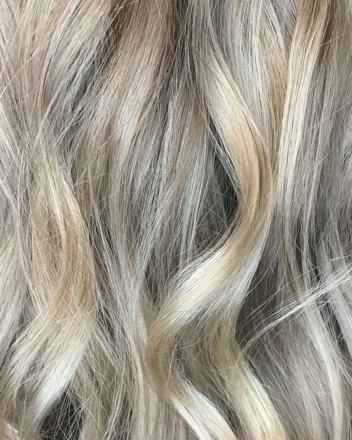 Smiling Woman With Wavy Hair Getting Her Hair Styled in a Salon — @miilan in Darwin City, NT