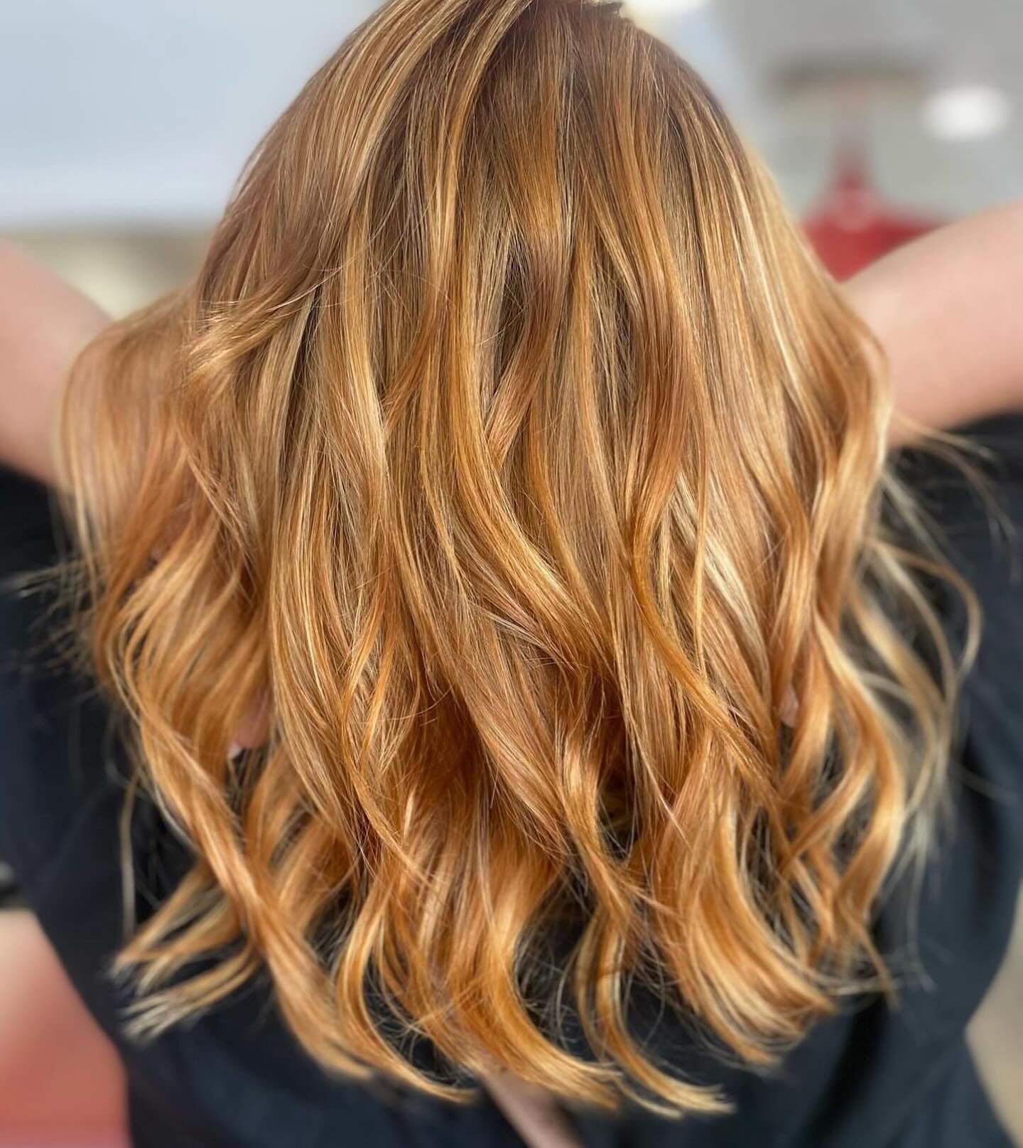 Hairdresser Styling a Client's Wavy Blonde Hair in a Salon — @miilan in Darwin City, NT