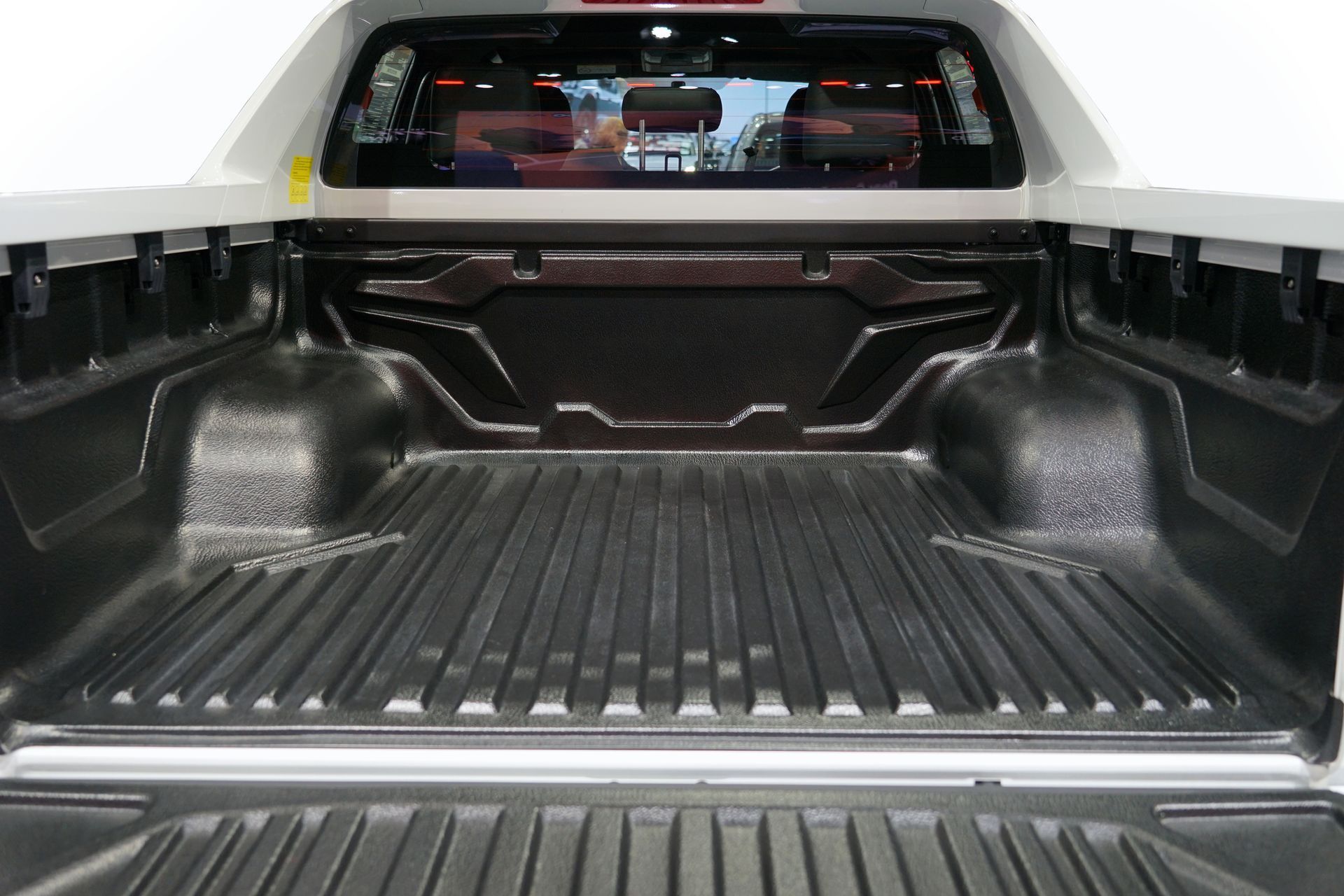 The back of a truck with a headache rack on it
