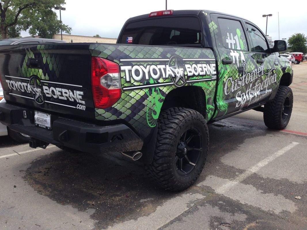 A toyota truck is parked in a parking lot