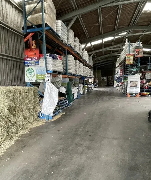 A Large Warehouse Filled With Lots of Bags of Hay — NQ Stockfeeds & Farm Supplies in Yorkeys Knob, QLD