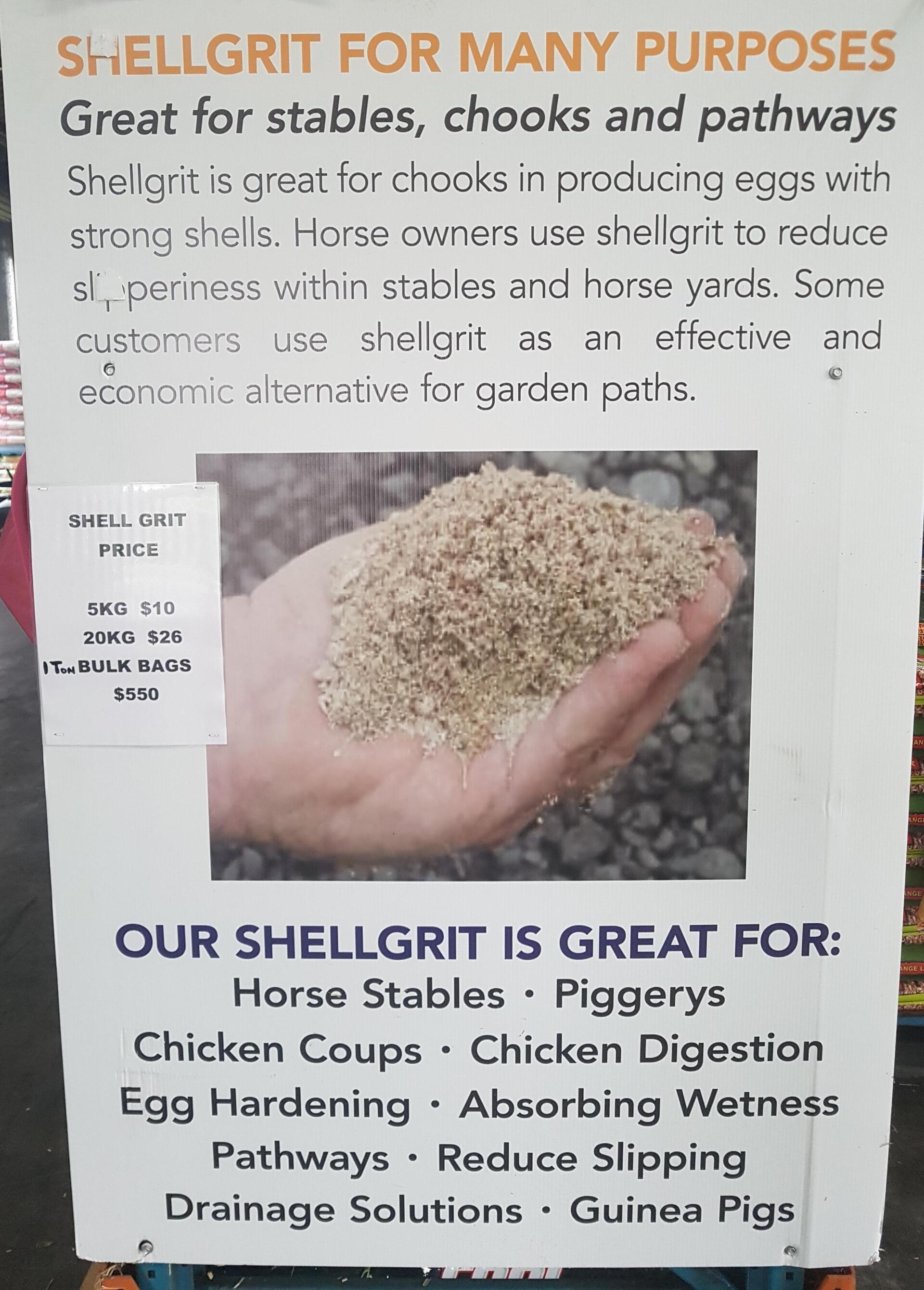 A Person is Holding a Pile of Shell Grit in Their Hand — NQ Stockfeeds & Farm Supplies in Yorkeys Knob, QLD