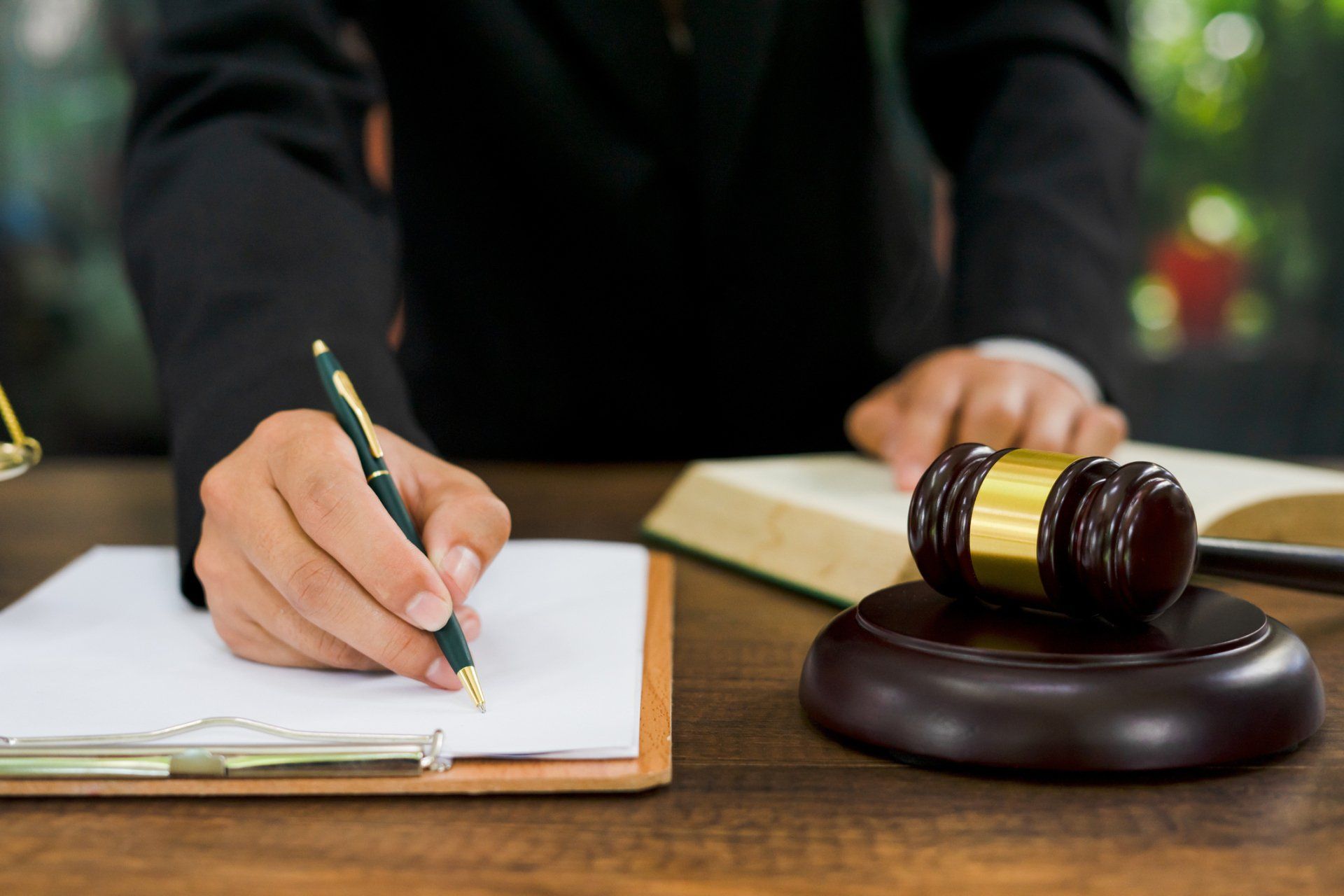 Lawyer Reading Lawbook In Office Workplace - Tampa, FL - Jeeves Law Group