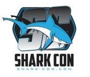 A logo for shark con with a shark on it.