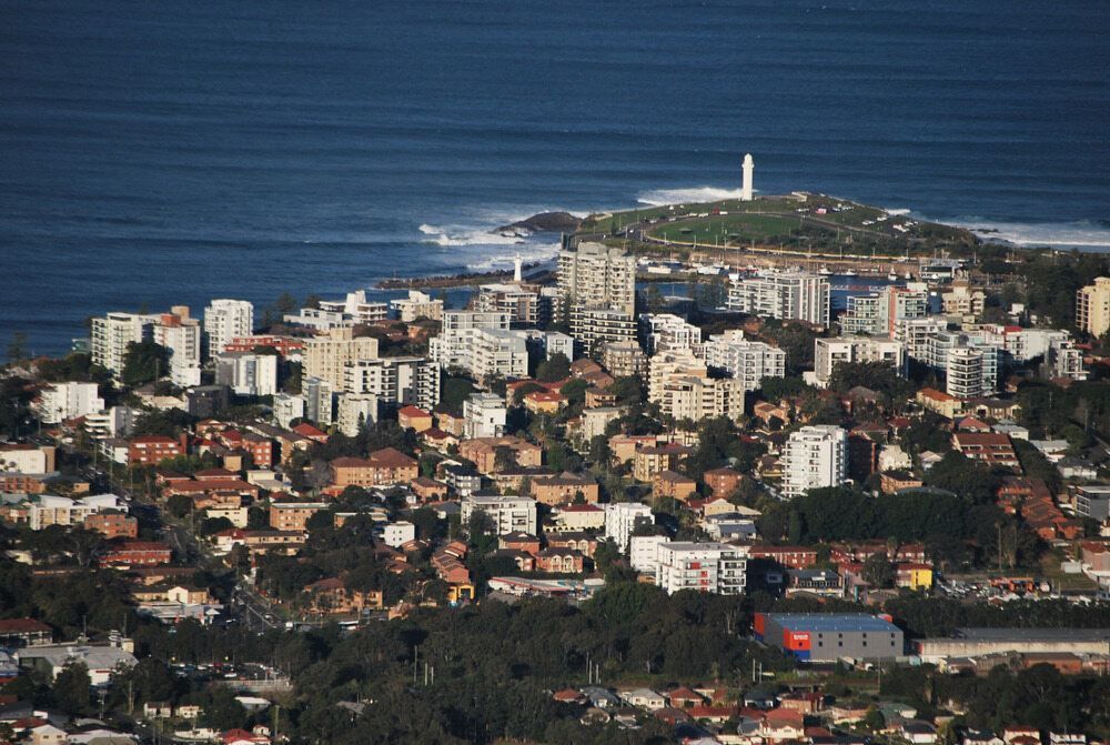 An Aerial View of a City Near the Ocean — Fix-It Automotive in Fairy Wollongong, NSW