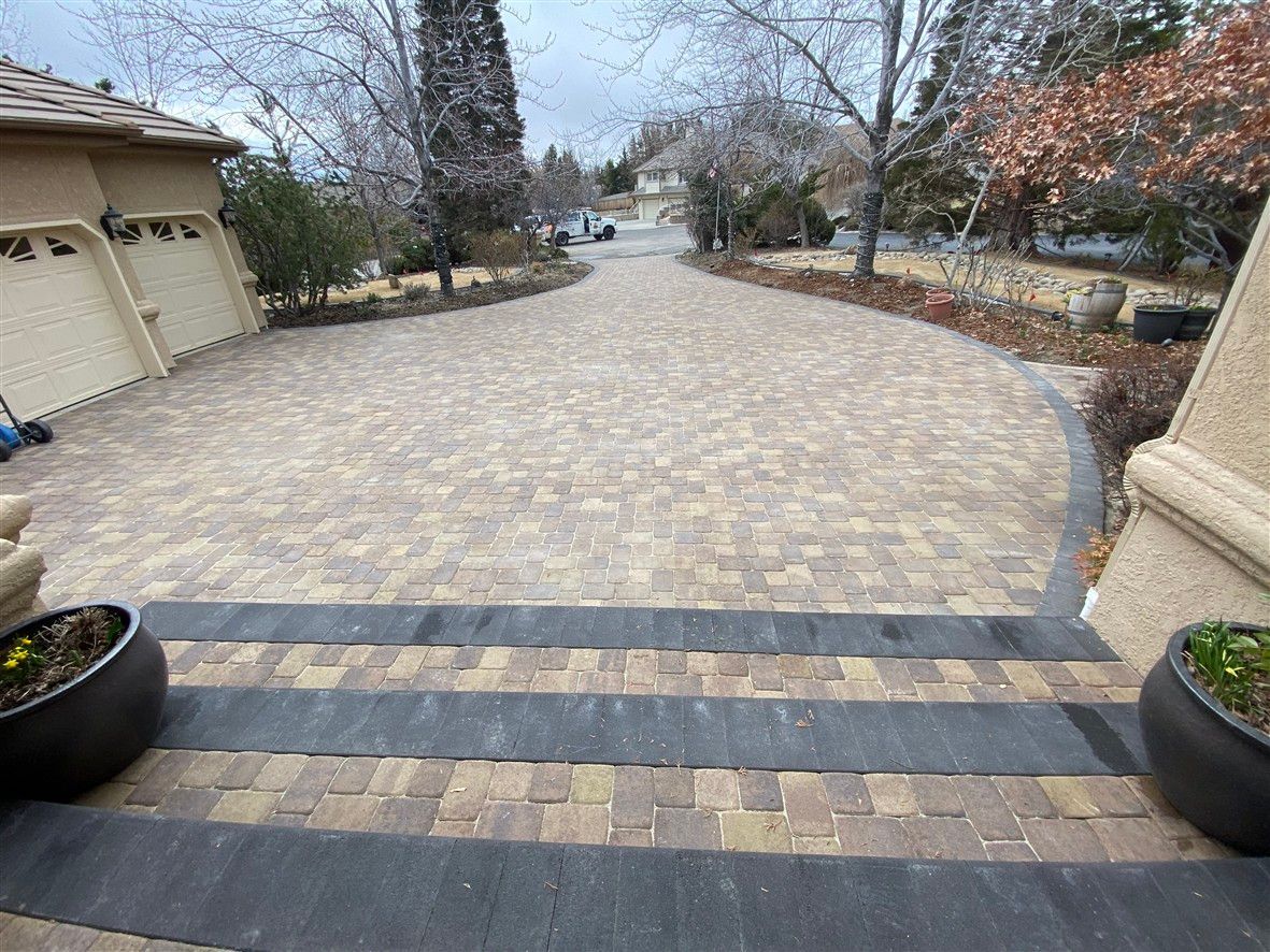 Curved multicolor paver driveway installation at Reno NV home