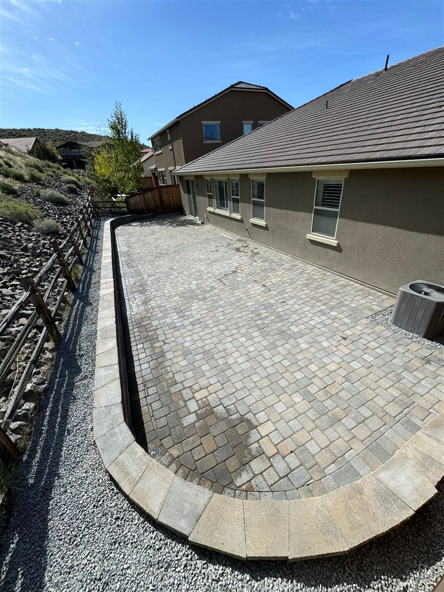 Driveway paver installation in Reno NV by All In Hardscape & Landscape with curved edge restraint and interlocking pavers