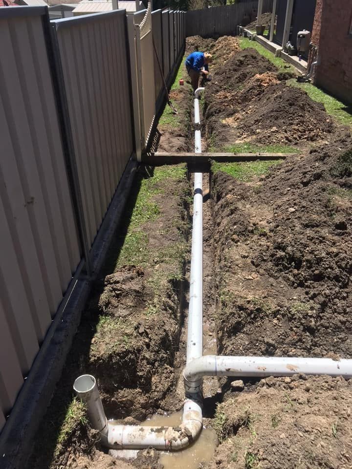 A Person Installing PVC Pipes — Expert Plumbing & Solar Services Bathurst in Kelso, NSW