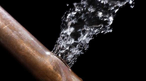 A Copper Pipe With a Significant Leak — Expert Plumbing & Solar Services Bathurst in Kelso, NSW