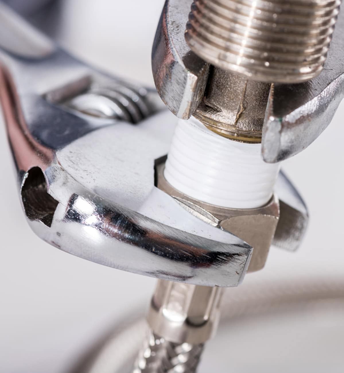 Wrench Tightening a Nut on a Pipe Connection — Expert Plumbing & Solar Services Bathurst in Blayney, NSW