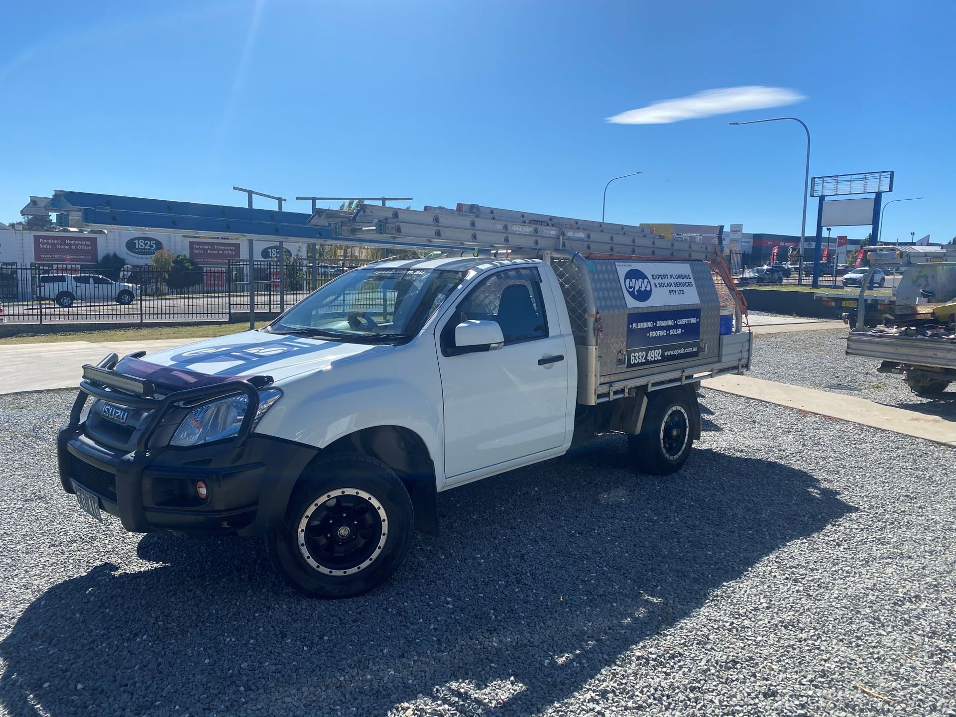 White Pickup Truck Parked Outdoors on a Sunny Day — Expert Plumbing & Solar Services Bathurst in Kelso, NSW