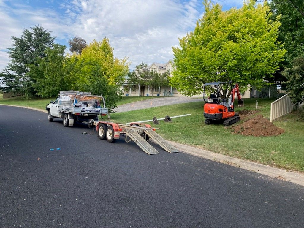 Truck Towing a Trailer With Equipment — Expert Plumbing & Solar Services Bathurst in Kelso, NSW