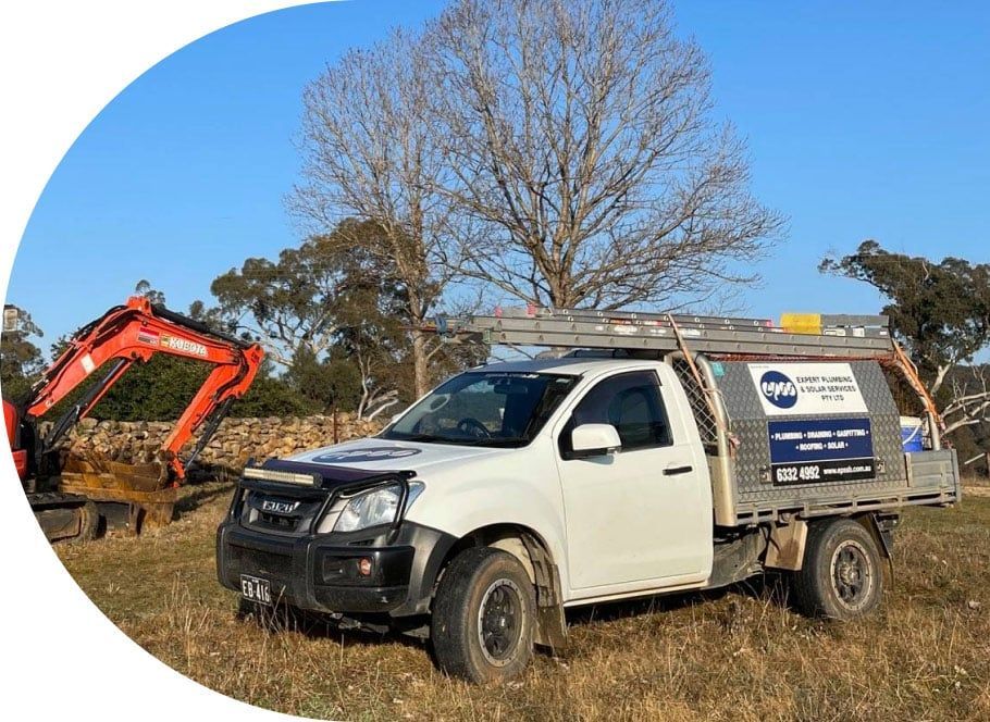 White Work Truck With Equipment, Parked in Field — Expert Plumbing & Solar Services Bathurst in Kelso, NSW