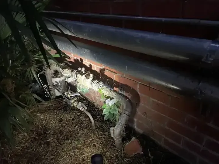 Pipes and Valves Outside a Brick Building — Expert Plumbing & Solar Services Bathurst in Kelso, NSW