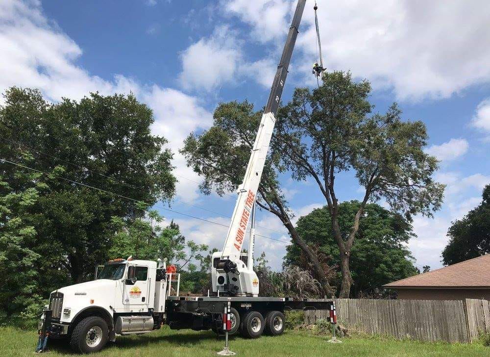 a kenworth truck with a crane attached to it