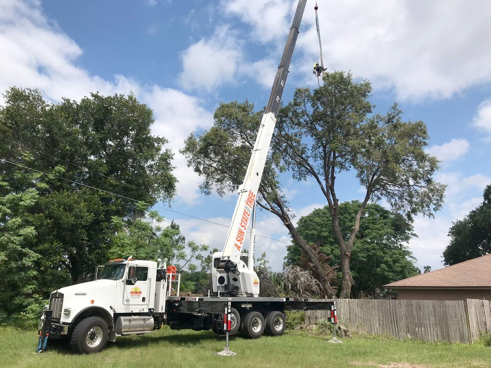 a kenworth truck has a crane attached to the back of it