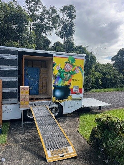 A Row of Shipping Containers Are Lined Up in a Parking Lot — O'Grady's Transport & Removals in Alstonville, NSW