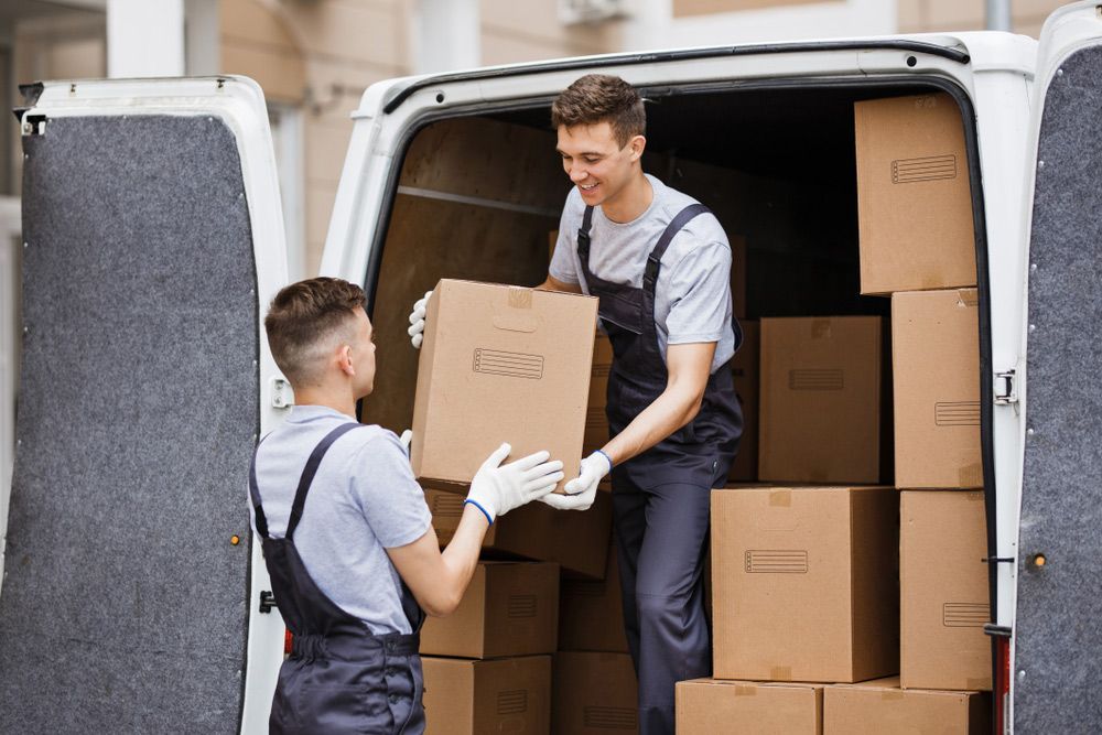 Sydney to Brisbane Movers Holding a Box — O'Grady's Transport & Removals in Alstonville, NSW