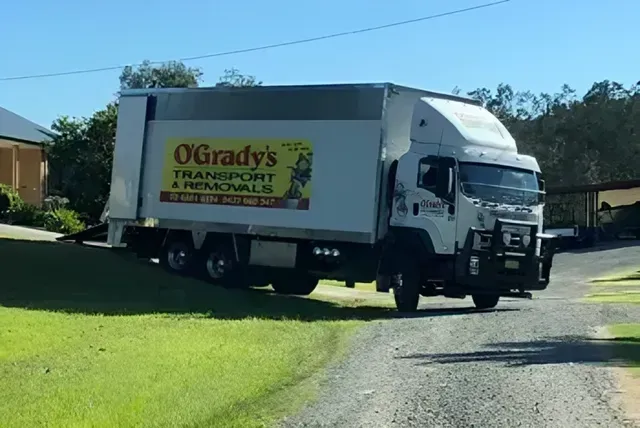 A Moving Truck is Parked on the Side of the Road — O'Grady's Transport & Removals in Alstonville, NSW