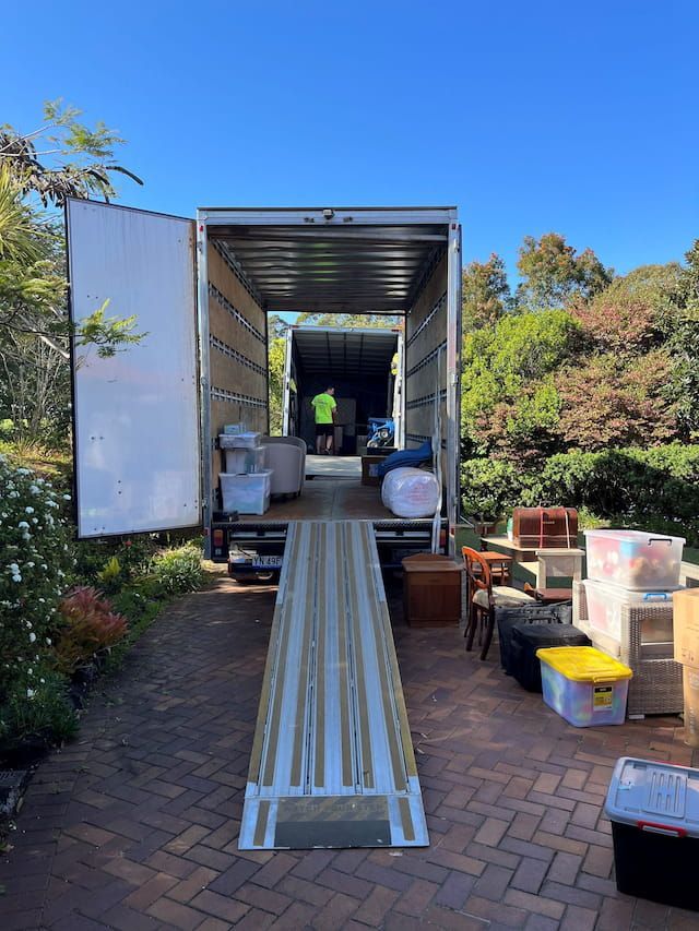 A Moving Truck is Filled With Boxes and a Ramp — O'Grady's Transport & Removals in Ballina, NSW