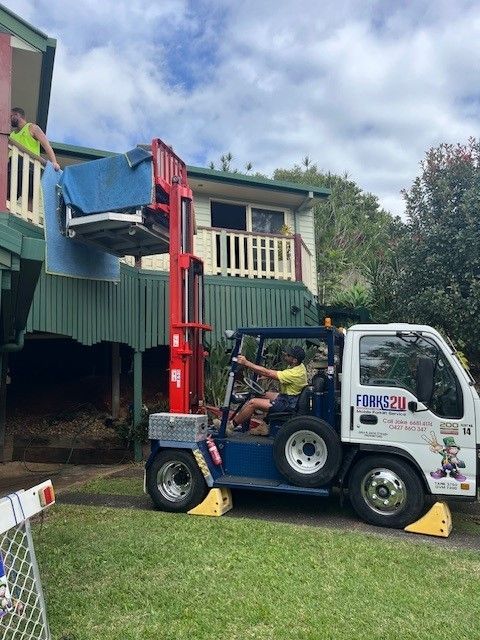A Man is Driving a Forklift in a Warehouse — O'Grady's Transport & Removals in Alstonville, NSW
