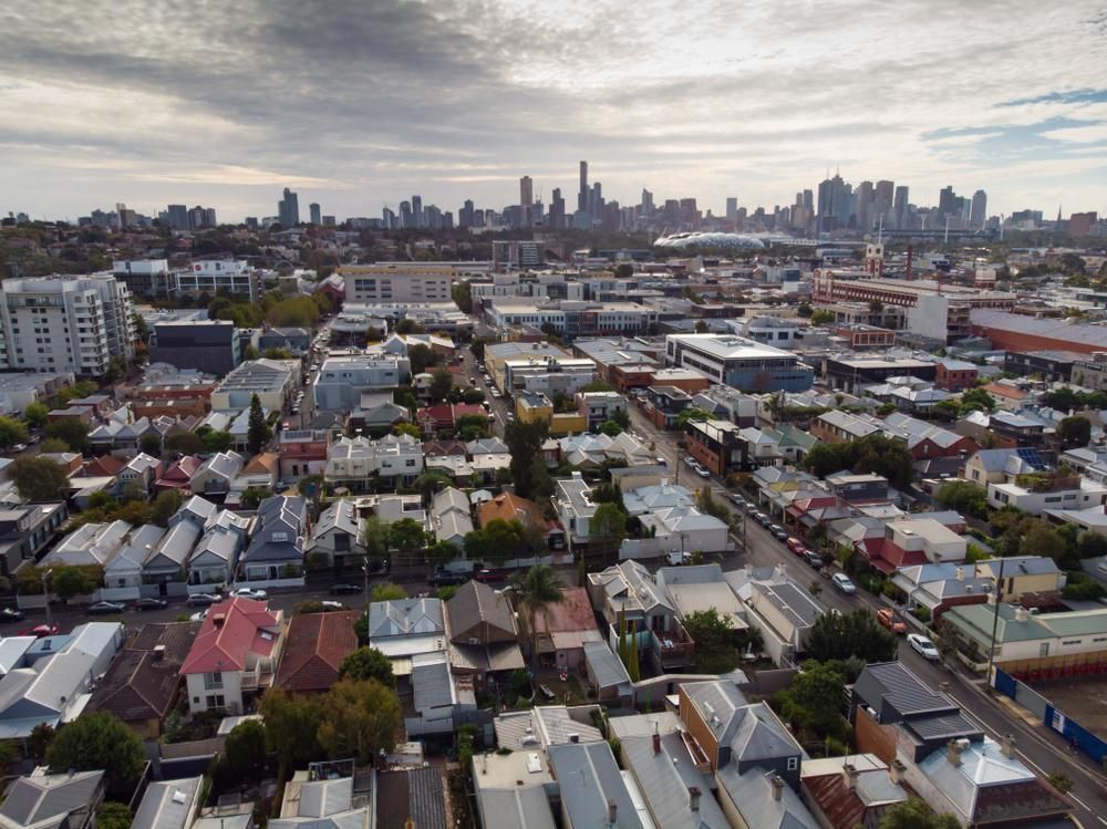 An Aerial View of a Residential Area With a City Skyline in the Background — O'Grady's Transport & Removals in Melbourne, NSW