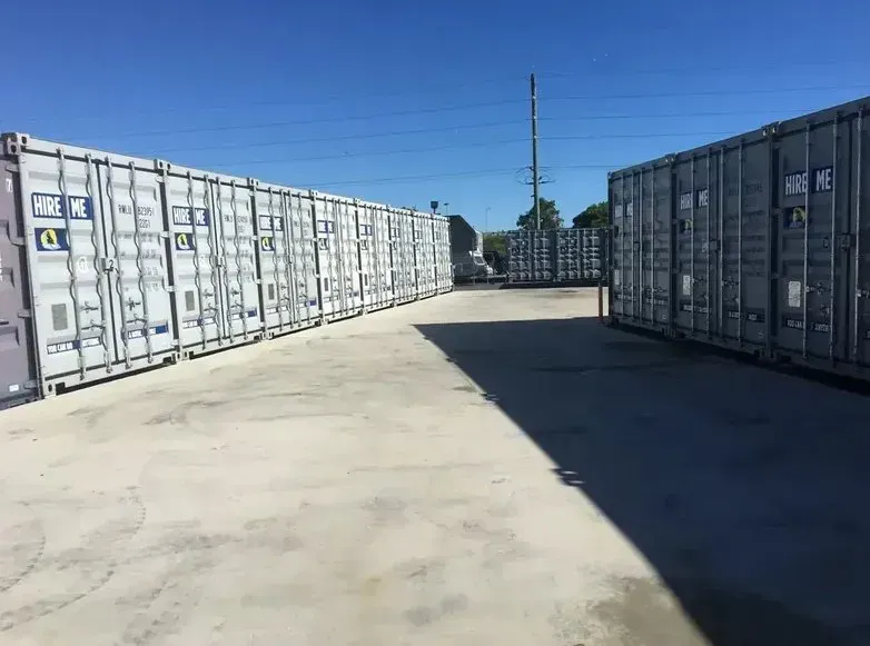 A Row of Shipping Containers Are Lined Up in a Parking Lot — O'Grady's Transport & Removals in Alstonville, NSW