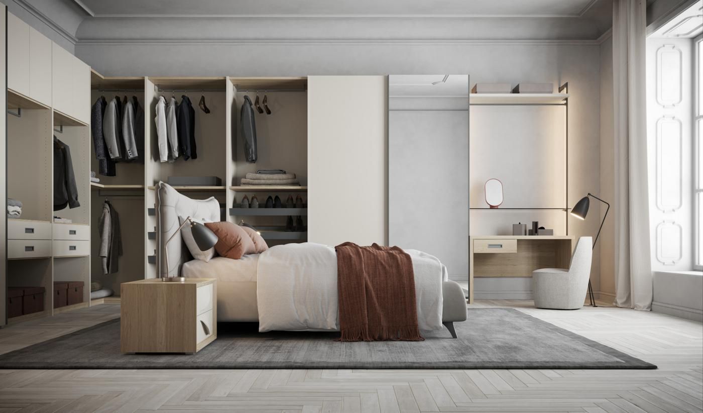 Una camera da letto con un letto, un comodino, una scrivania e un armadio.