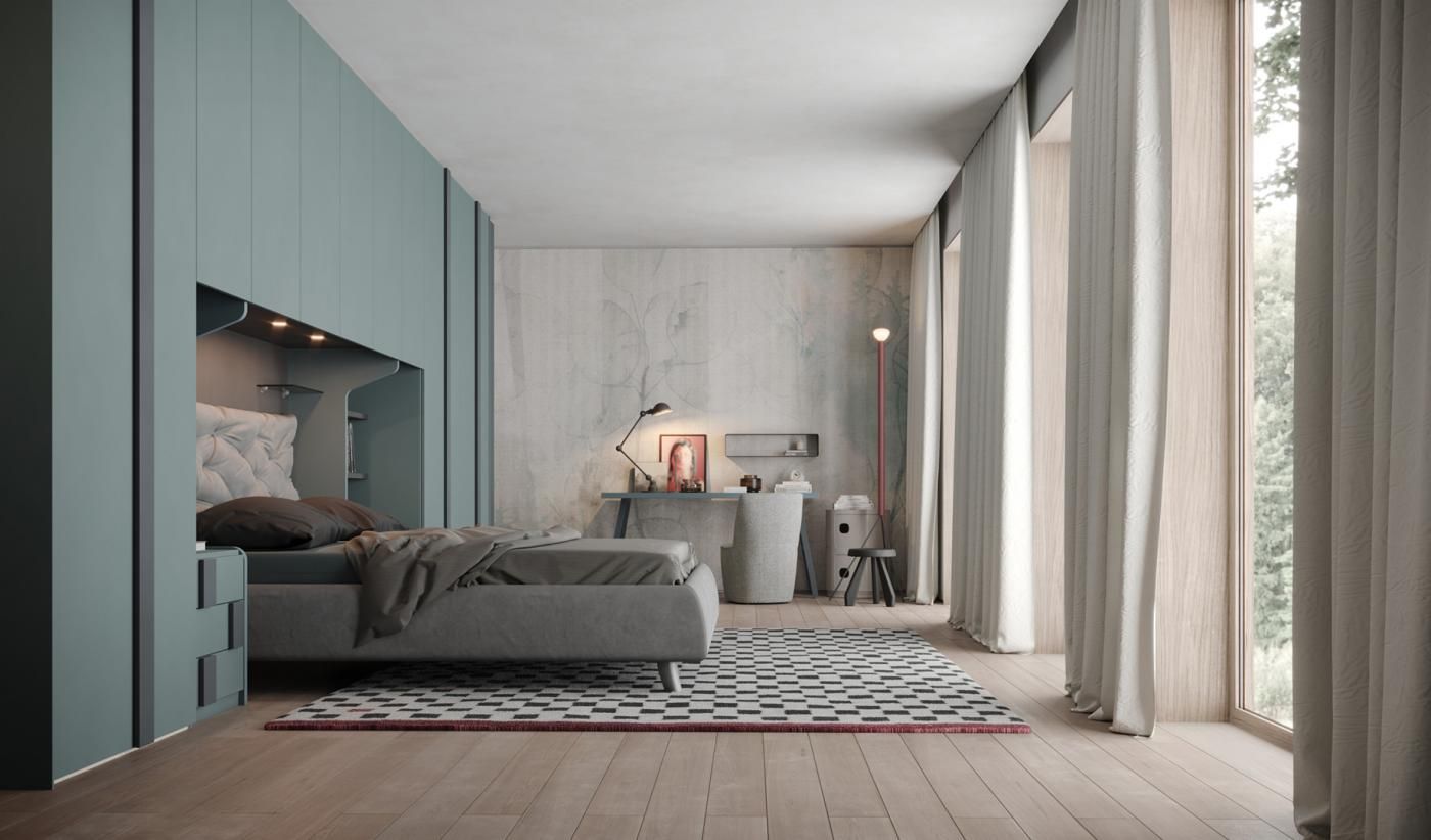 Una camera da letto con un letto, una scrivania, un tappeto e grandi finestre.