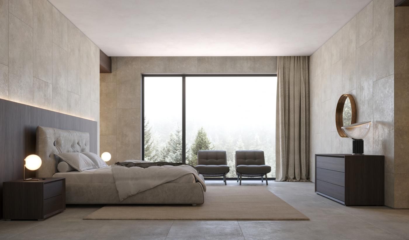 Una camera da letto con un letto, una cassettiera, sedie e una grande finestra.