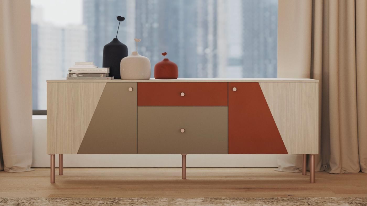 Una cassettiera con cassetti e ante in un soggiorno accanto a una finestra.