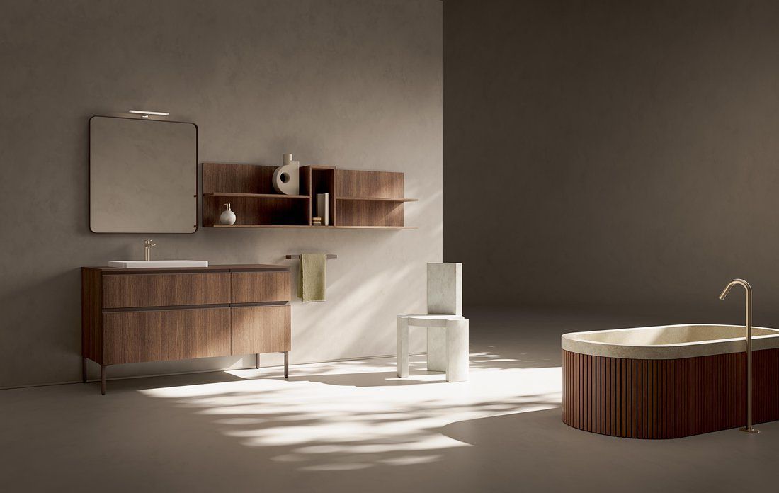 Un bagno con vasca, lavandino e specchio