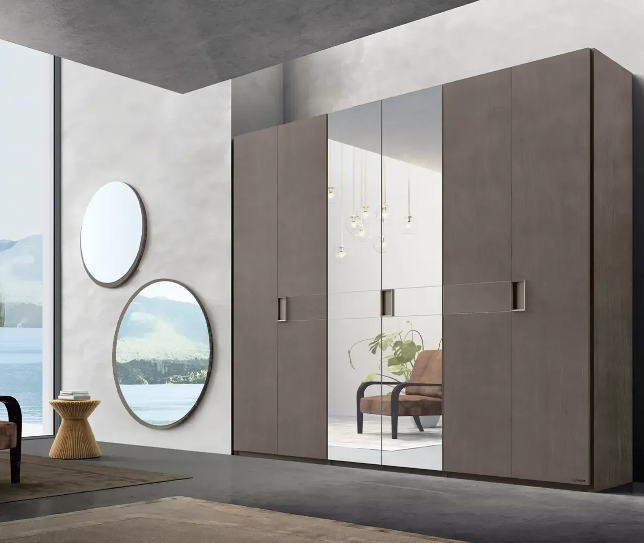 Una stanza con un armadio e due specchi sul muro