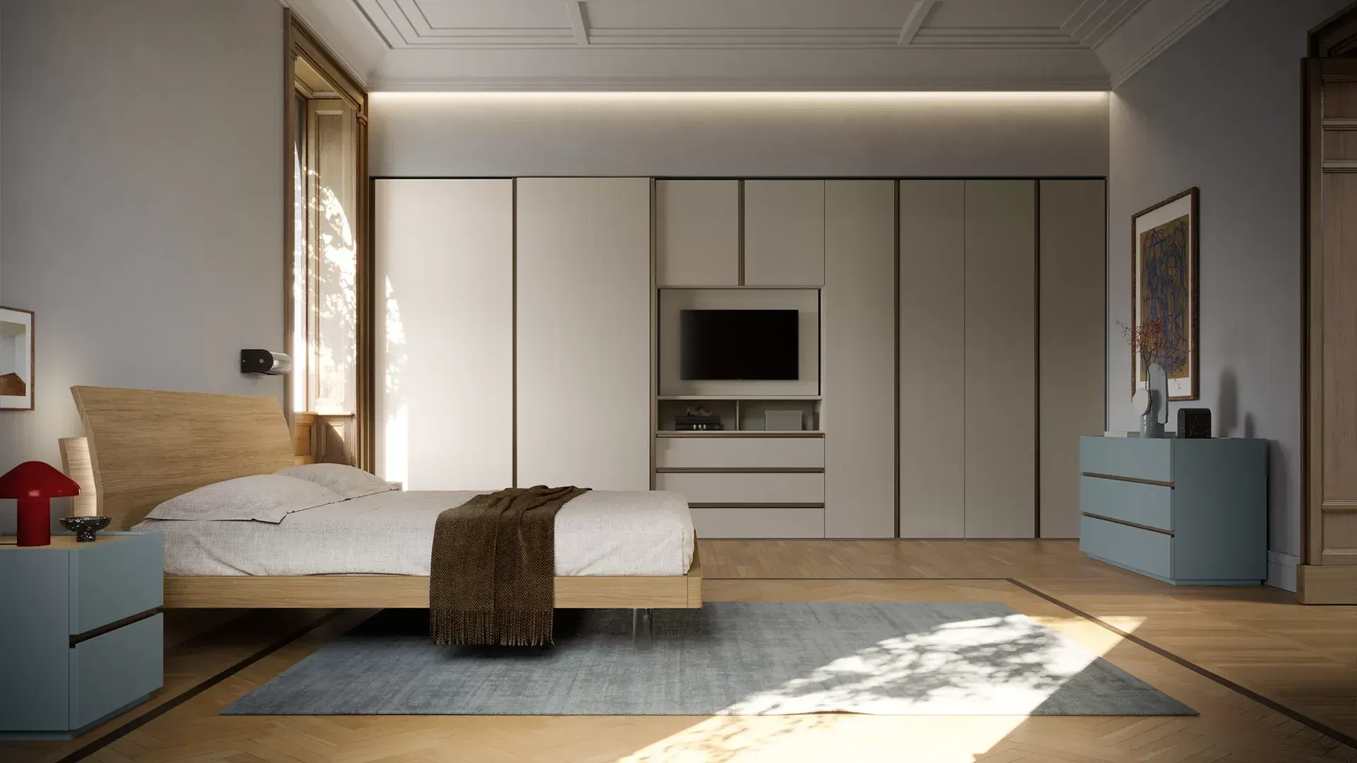 Una camera da letto con un letto, una cassettiera, un comodino e una televisione.