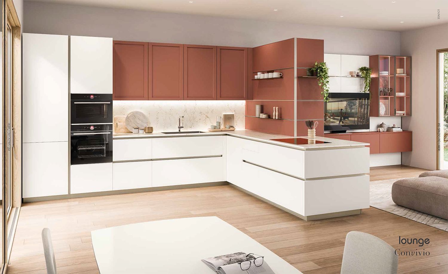 Una cucina con mobili bianchi e una grande isola al centro.