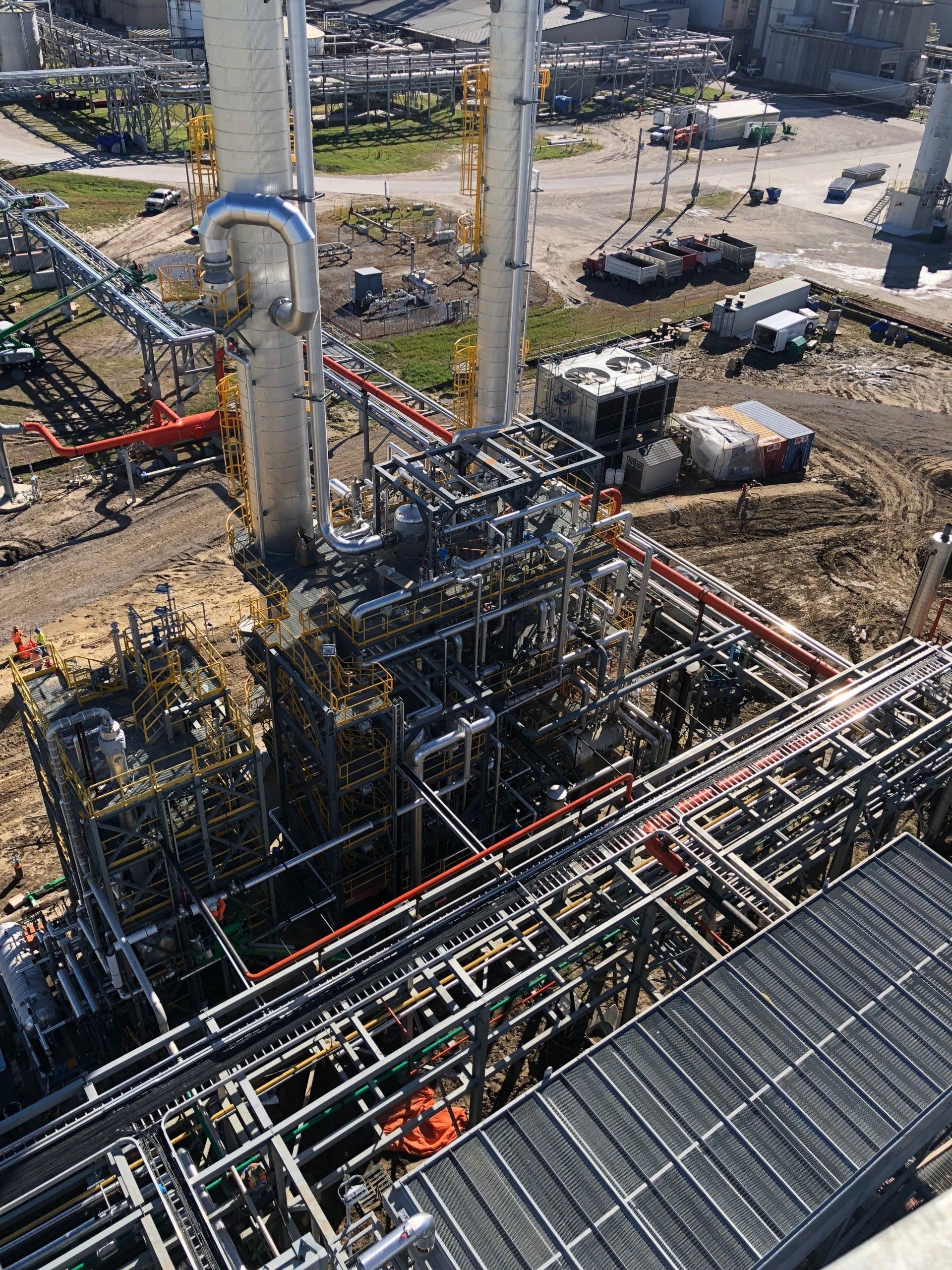 An aerial view of a large industrial plant under construction.