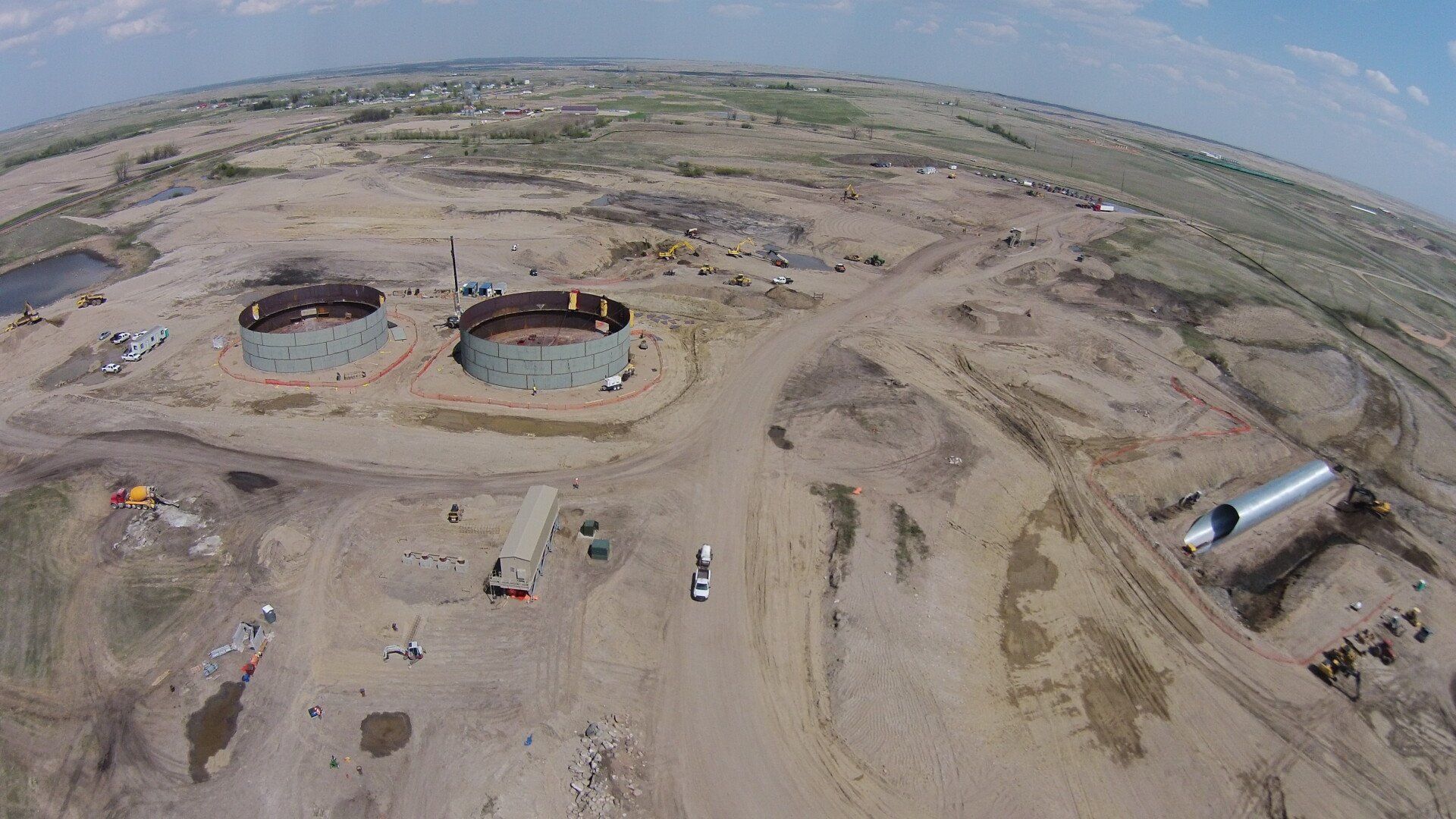 An aerial view of a construction site in the middle of a desert.
