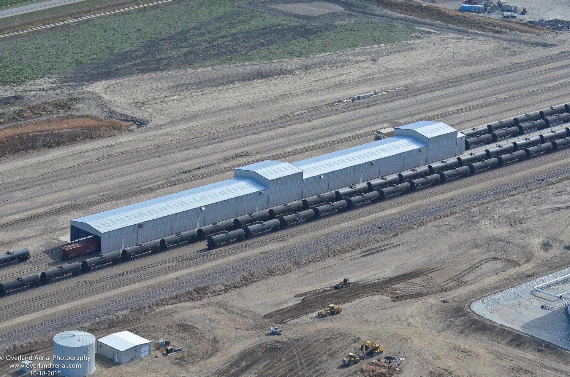 An aerial view of a train yard with a lot of train cars