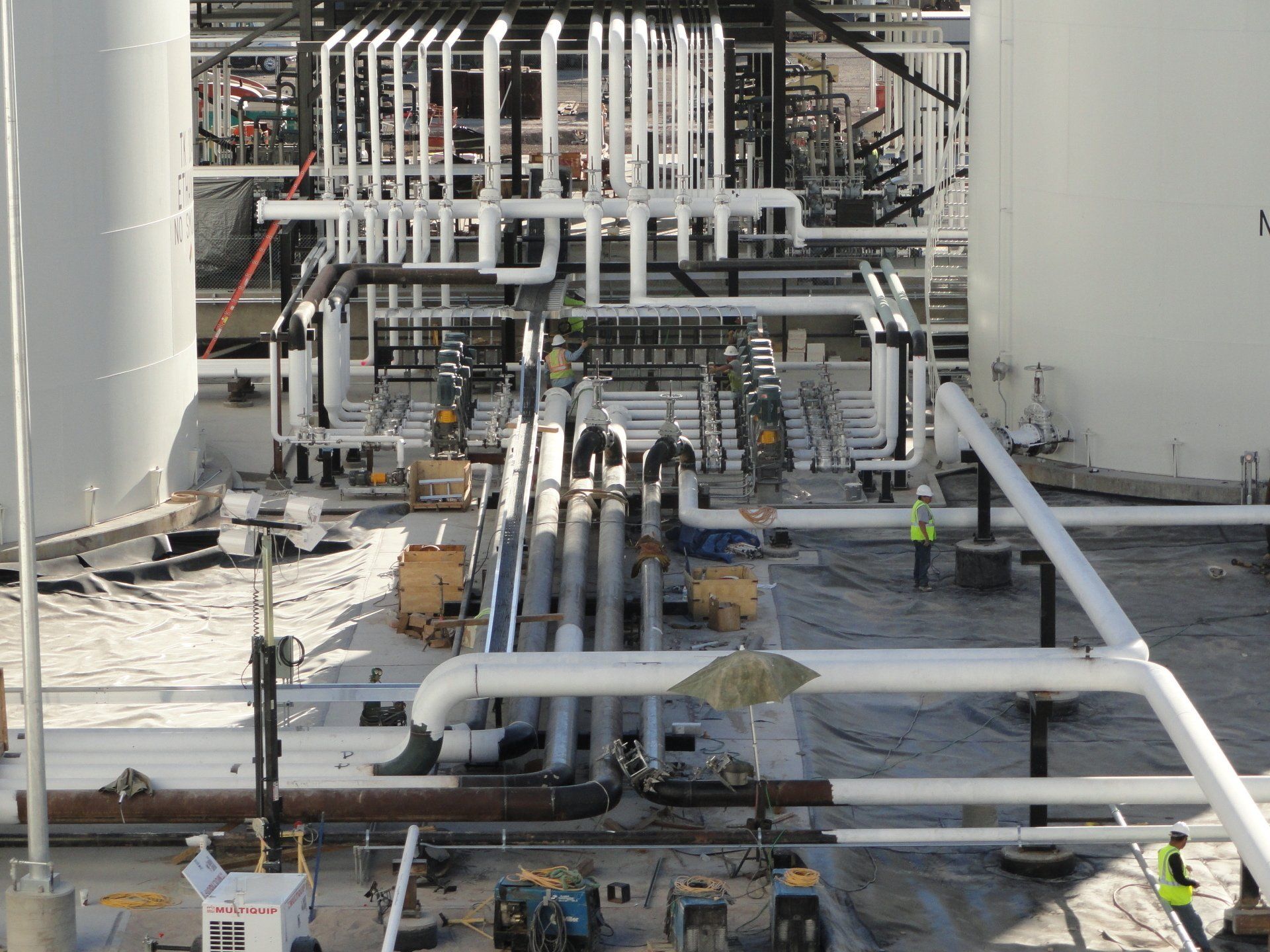 A bunch of pipes are lined up in a factory